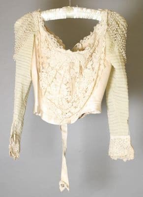 Cream satin wedding dress, 1900, USA; New York City, designed by W. Mulhall, worn by Charlotte Mabel Dwight at her wedding on 26 April 1900