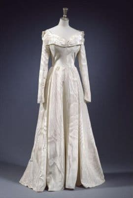 Wedding dress, 1948, English, Molyneux, ivory moire ribbed silk. With two petticoats, a net veil attached to padded satin headband, and pair of heeled shoes, 1948, English, Rayne, covered in cream silk moire with silver gilt buckles