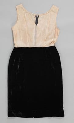 Matching black velvet dress and jacket with gold basket brooch