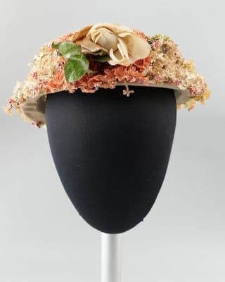 Hat with peach green and yellow fabric flowers