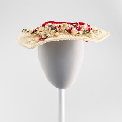 Cream hat with fabric flowers and red bows