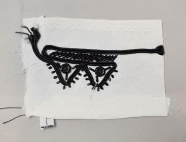 Black Silk Embroidery Sample on White Cotton