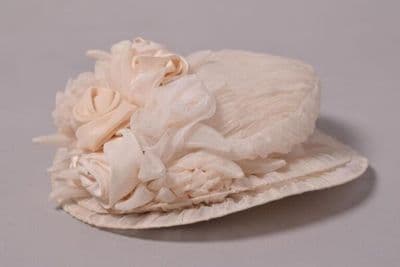 Hat of pleated chiffon trimmed with silk and chiffon, designed and made by Shirley Hex to accompany a John Galliano bridesmaid dress, London, 1987