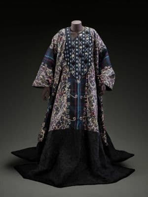 Bespoke caftan by Patience Torlowei for André Leon Talley, August 2019. Reversible, one side black and brown hand-crinkled silk dupioni with embroidery and applique butterfly details,the reverse of blue, white and purple plaid and printed fabric over-embr